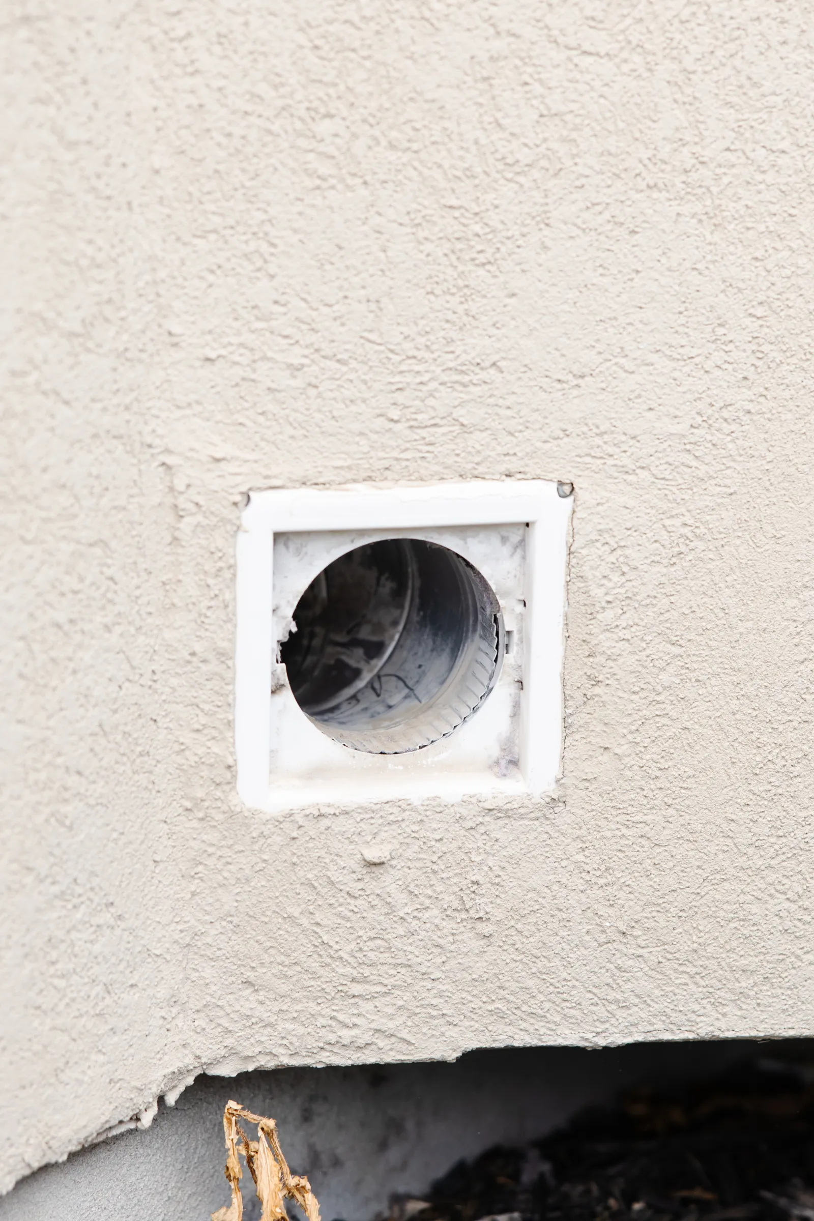 dryer vent on the side of a home
